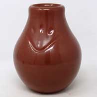 Red jar carved with a bear paw imprint
 by Nathan Youngblood of Santa Clara