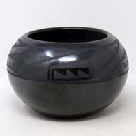 Black on black jar with kiva step and geometric design
 by Desideria Montoya of San Ildefonso