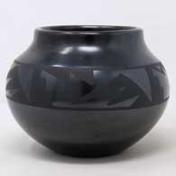 Black on black jar with 4-direction geometric design
 by Maria Martinez of San Ildefonso