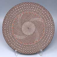 Polychrome plate with a North Star, fine line, snowflake and geometric design
 by Rebecca Lucario of Acoma