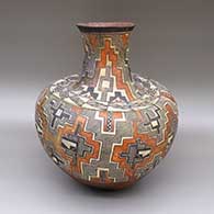 Polychrome jar with a tall neck, a flared opening, and a painted traditional Acoma design featuring fine line, checkerboard, and geometric elements
 by Unknown of Acoma