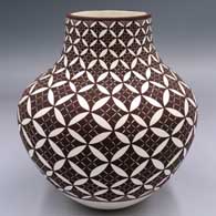 Black-on-white jar with a pumpkin seed snowflake and geometric design
 by Amanda Lucario of Acoma