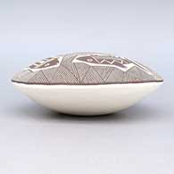 Black and white seed pot with a Mimbres fish and geometric design, click or tap to see a larger version