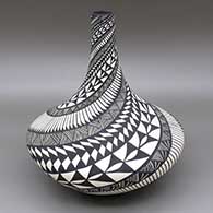 Black and white jar with a tall neck and a painted feather, fine line, and geometric design
 by Sandra Victorino of Acoma