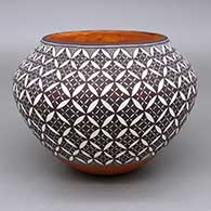 Polychrome jar with a geometric design
 by Rebecca Lucario of Acoma