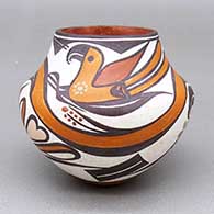 Small polychrome jar with a traditional Acoma design featuring parrot, flower, branch, berry, and geometric elements
 by Shyatesa White Dove of Acoma