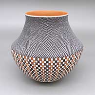 Polychrome jar with a slightly flared opening and a geometric design based on a checkerboard background
 by Frederica Antonio of Acoma