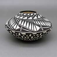 Black-on-white jar with a painted kiva step, feather ring, and geometric design
 by Sandra Victorino of Acoma