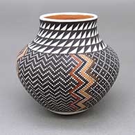 Small polychrome jar with a slightly flared opening and a painted geometric design based on a checkerboard background
 by Frederica Antonio of Acoma