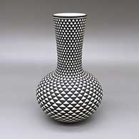 Black-on-white jar with a tall, flared neck and a painted geometric design
 by Paula Estevan of Acoma