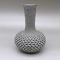 Black-on-white jar with a tall, flared neck and a painted geometric design
 by Paula Estevan of Acoma