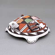 Small polychrome turtle figure with an applique and painted butterfly, ladybug, and geometric design on shell
 by Mary I Lewis of Jemez