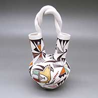 Polychrome wedding vase with a braided handle and a lizard, parrot, fine line, flower, and geometric design
 by Judy Lewis of Acoma