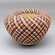 A polychrome jar with a geometric design and rolled-inside rim
 by Frederica Antonio of Acoma