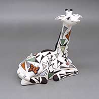 Polychrome giraffe figure with an applique and painted butterfly, bird, ladybug, lizard, caterpillar, fine line, and geometric design
 by Judy Lewis of Acoma