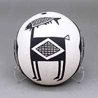 Black-on-white seed pot with a Mimbres animal and geometric design
 by Emma Lewis of Acoma