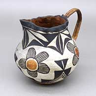 Small polychrome pitcher with a pie crust opening and a flower, fine line, and geometric design
 by Unknown of Acoma