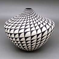 Black-on-white jar with a spiral mesa geometric design
 by Sandra Victorino of Acoma