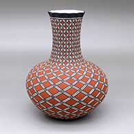 A tall-neck polychrome vase with a pie crust rim and decorated with a spiraling geometric design
 by Paula Estevan of Acoma
