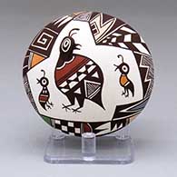 A polychrome seed pot decorated with a family of quail and geometric design
 by Carolyn Concho of Acoma