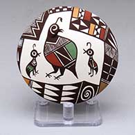 A small polychrome seed pot with a family of quail and a geometric design above the shoulder
 by Carolyn Concho of Acoma