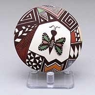 A polychrome seed pot decorated with a butterfly, fine line and geometric design
 by Carolyn Concho of Acoma