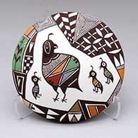 A polychrome seed pot decorated with appliques and a family of quail, a lady bug and geometric design
 by Carolyn Concho of Acoma