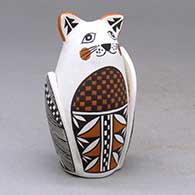 Click for a larger view A polychrome cat effigy similar to a Corn Maiden, decorated with a fineline and geometric design
by Tehya Davis of Acoma