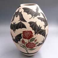 Polychrome jar with a bat and rose plant design
 by Adrian Corona of Mata Ortiz and Casas Grandes