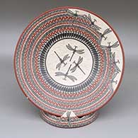 Polychrome plate with sgraffito and painted dragonfly and geometric design, with matching stand
 by Octavio Silveira of Mata Ortiz and Casas Grandes