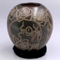 Polychrome jar with a slipped and sgraffito Night of the Dead design
 by Jose Almeraz of Mata Ortiz and Casas Grandes