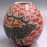 Polychrome jar with a sgraffito and painted 2-panel  bull elk and mesh design
 by Heri Mora of Mata Ortiz and Casas Grandes