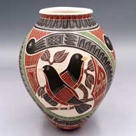Polychrome jar with a flared lip and a 3-panel bird, branch, leaf and geometric design
 by Hilario Quezada Jr of Mata Ortiz and Casas Grandes