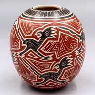 Polychrome jar with a lightly-carved, sgraffito and painted roadrunner and geometric design
 by Humberto Pina of Mata Ortiz and Casas Grandes