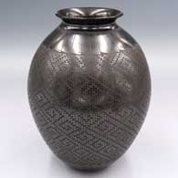 Black-on-black jar with a rolled lip and a cuadrillos and geometric design
 by Armando Mora of Mata Ortiz and Casas Grandes