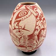 Red-on-white jar with a sgraffito and slipped optical illusion wildlife, nature and geometric design
 by Abraham Rodriguez of Mata Ortiz and Casas Grandes