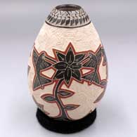 Polychrome jar with a sgraffito and slipped hummingbird, vine, flower and geometric design
 by Octavio Silveira of Mata Ortiz and Casas Grandes