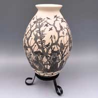 Black-on-white jar with a sgraffito Day of the Dead at the cemetery design
 by Diana Loya of Mata Ortiz and Casas Grandes