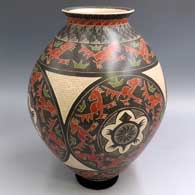 Polychrome jar with a flared rim and a sgraffito and painted 4-medallion, turtle, roadrunner and geometric design
 by Eleuterio Pina of Mata Ortiz and Casas Grandes