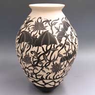Black-and-white jar with a flared lip and a sgraffito bat, flower, vine and geometric design
 by Diana Loya of Mata Ortiz and Casas Grandes