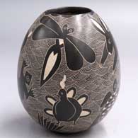 Black-and-white jar with a sgraffito animal, insect, bird, reptile and geometric design
 by Alex Ortega of Mata Ortiz and Casas Grandes