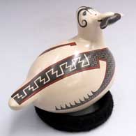 Polychrome bird figure with a fish in its beak and a geometric design
 by Gerardo Tena of Mata Ortiz and Casas Grandes