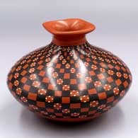 Polychrome jar with a rolled square lip and a cuadrillos and spiral geometric design
 by Yoly Ledezma of Mata Ortiz and Casas Grandes