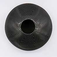 Black-on-black jar with geometric design
 by Octavio Andrew of Mata Ortiz and Casas Grandes