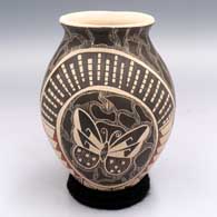 Polychrome jar with a flared lip and a sgraffito and painted butterfly and geometric design
 by Unknown of Mata Ortiz and Casas Grandes