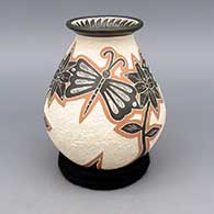 Polychrome jar with flared lip and sgraffito and painted butterfly, flower, leaf, and geometric design
 by Octavio Silveira of Mata Ortiz and Casas Grandes