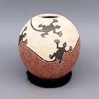 Polychrome jar with sgraffito and painted lizard and geometric design
 by Octavio Silveira of Mata Ortiz and Casas Grandes