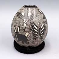 Black jar with sgraffito butterfly, animal and geometric design
 by Alex Ortega of Mata Ortiz and Casas Grandes