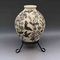 Large black and white jar with flared rim and sgraffito bat and flower design
 by Adrian Corona of Mata Ortiz and Casas Grandes
