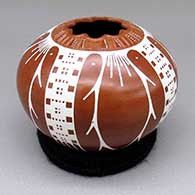 Red and white jar with a geometric cut opening and a sgraffito and painted geometric design
 by Angel Amaya of Mata Ortiz and Casas Grandes